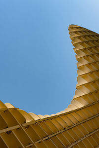 Low angle view of building against clear blue sky