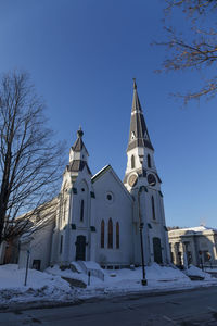 Low angle view of building against sky during winter