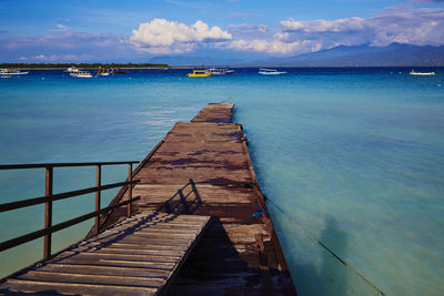 Pier over sea against sky