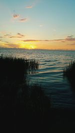 Scenic view of sea at sunset