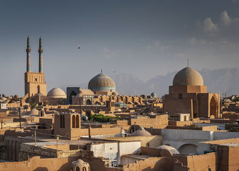 Panoramic view of buildings in city against sky