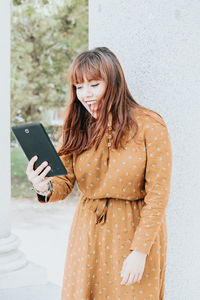 Young woman using mobile phone