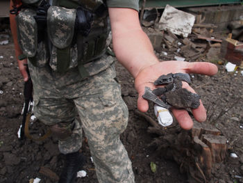 Close-up of military man holding fragment
