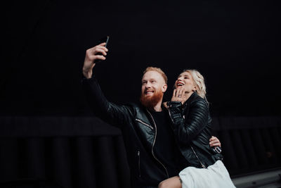 Young couple using mobile phone