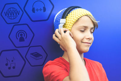 Podcast and streaming concept, listen online. audiobook, entertainment. boy enjoy music, headphone