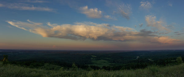 Scenic view of field against sky during sunset