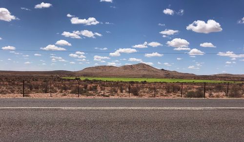 Scenic view of road against mountains 