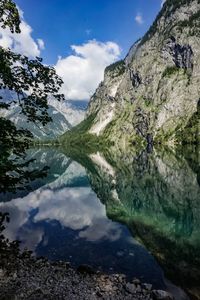 Scenic view of lake and mountains against sky