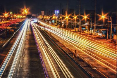 High angle view of light trails on road at night