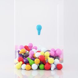 Close-up of multi colored candies against white background