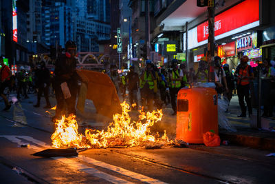 People on street in city at night