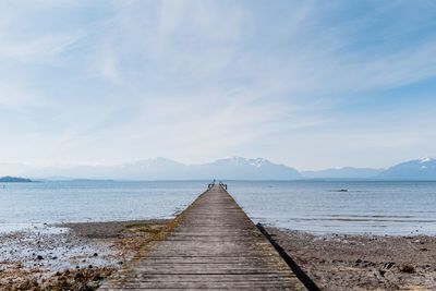 Pier over sea against sky