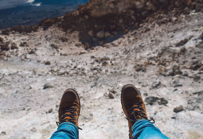 Low section of person on rock