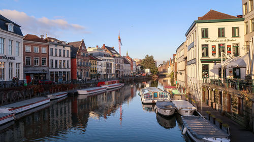 Gent, belgium, 8th of november 2021 - river channels and buildings during sunset