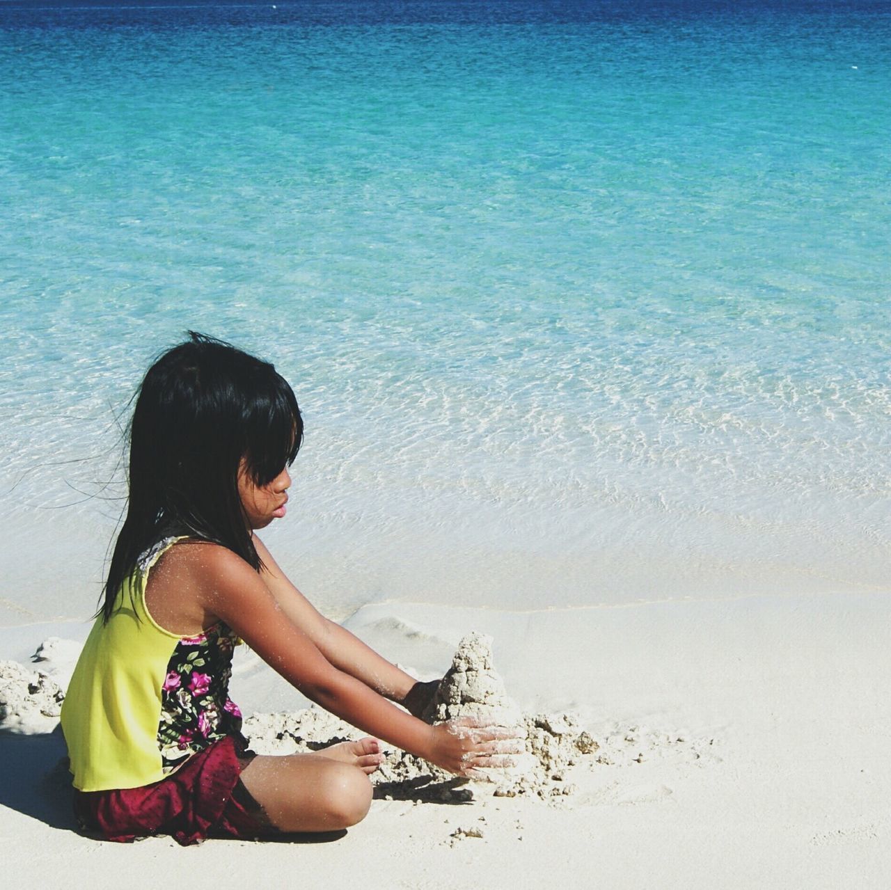 sea, beach, lifestyles, leisure activity, water, horizon over water, shore, young adult, young women, vacations, person, sand, relaxation, long hair, beauty in nature, tranquility, rear view, standing