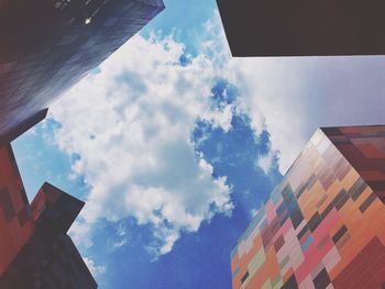 Low angle view of building against cloudy sky