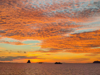 Scenic view of sea against orange sky