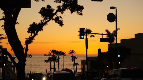 Street light against sky at sunset