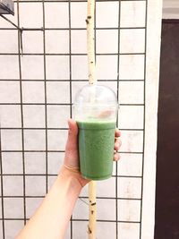 Close-up of hand holding drink