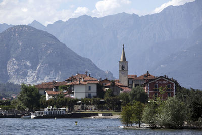 Panoramic view of buildings and mountains against sky