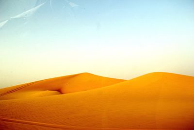 Scenic view of desert against clear sky