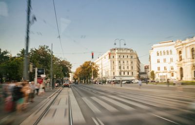 Road in city against sky