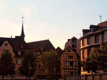 Buildings in city against sky