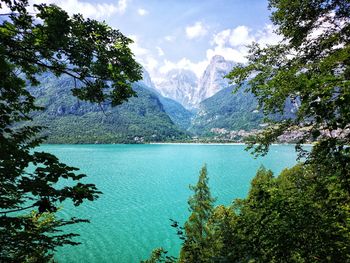 Scenic view of lake and mountains against sky