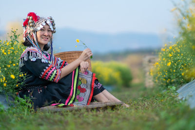 Woman sitting on field