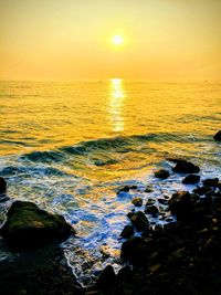 Scenic view of sea against sky during sunset