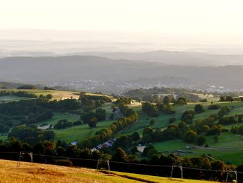 Scenic view of agricultural landscape against sky