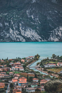 High angle view of townscape by sea