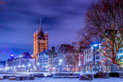 Illuminated buildings in city at night