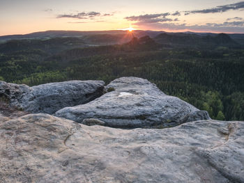 Hike climbing mountains, peaks and rounded forest peaks. fresh air on a sunny morning among  rocks