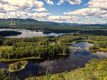 Scenic view of lake against sky - mont sourire , quebec, canada