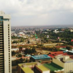 Cityscape against cloudy sky