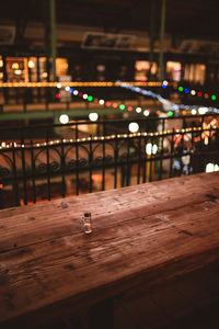 View of illuminated glass of table at night