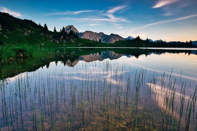 Scenic view of lake against sky during sunset