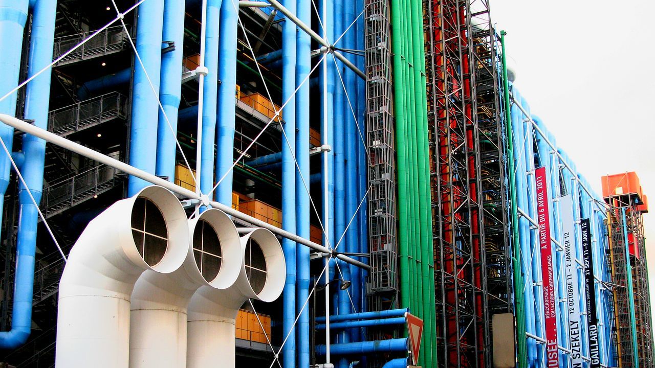 low angle view, architecture, built structure, metal, blue, building exterior, metallic, modern, no people, clear sky, industry, day, outdoors, factory, city, building, sky, multi colored, connection, construction site