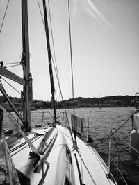 Sailboat sailing on sea against clear sky