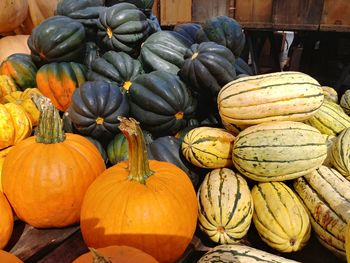 Stack of pumpkins for sale at market stall