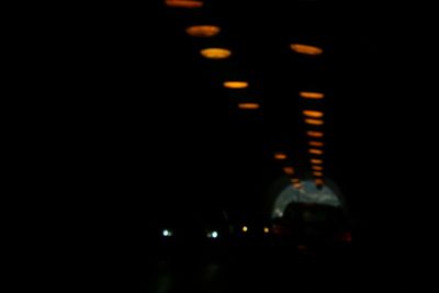 Low angle view of illuminated lights at night