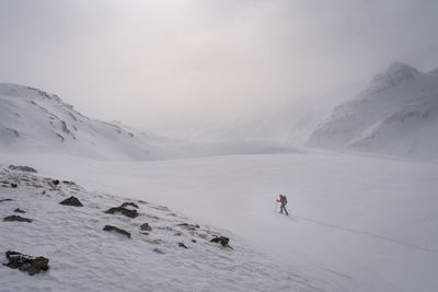 Scenic view of snowcapped mountains during winter