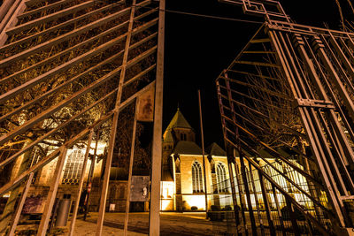 Low angle view of illuminated building at night