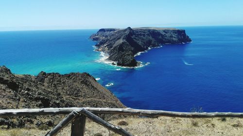 Scenic view of sea against clear blue sky