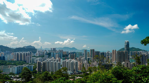 Modern buildings in city against sky