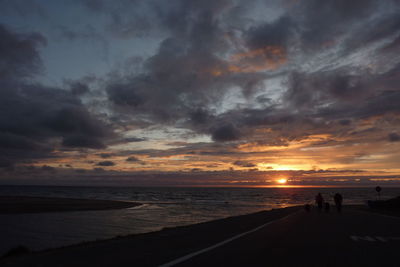 Scenic view of sea against cloudy sky