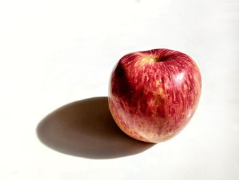 High angle view of apple against white background