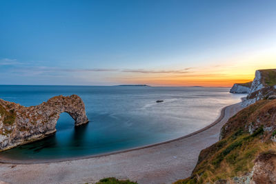 The natural arch durdle door at the jurassic coast in england after sunset