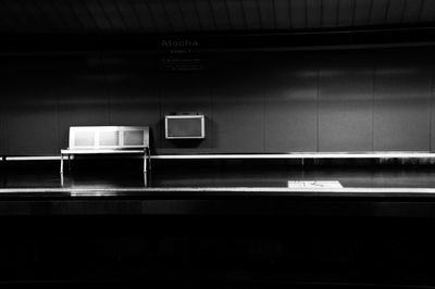Empty metal seat on subway platform